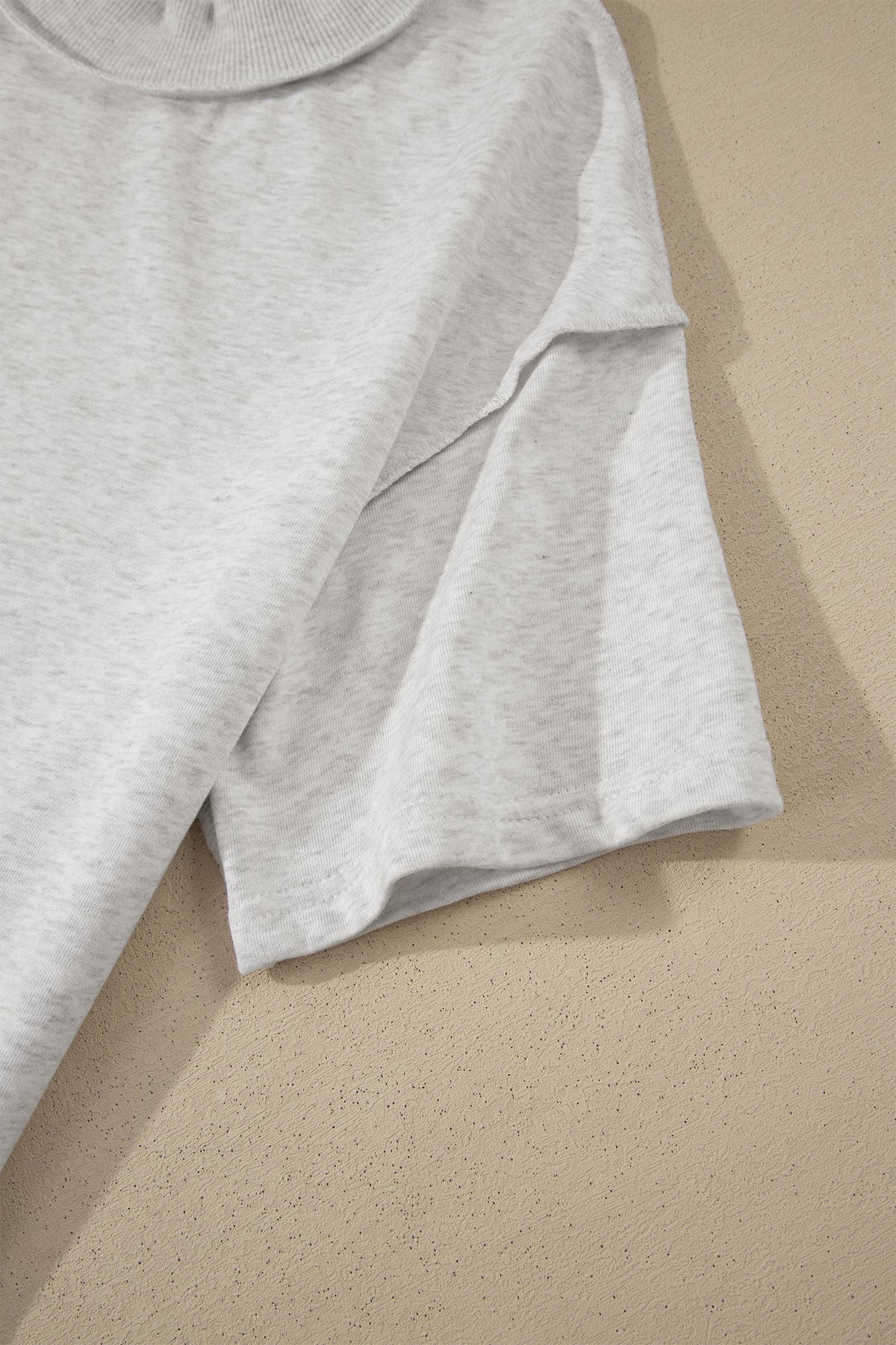 Solid Exposed Seam Mock Neck Tee