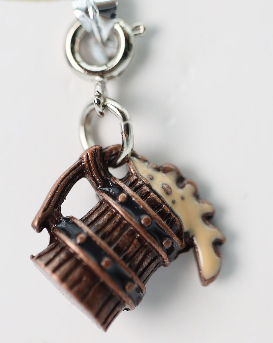 Traveler's Trinkets: Wooden Stein Charm