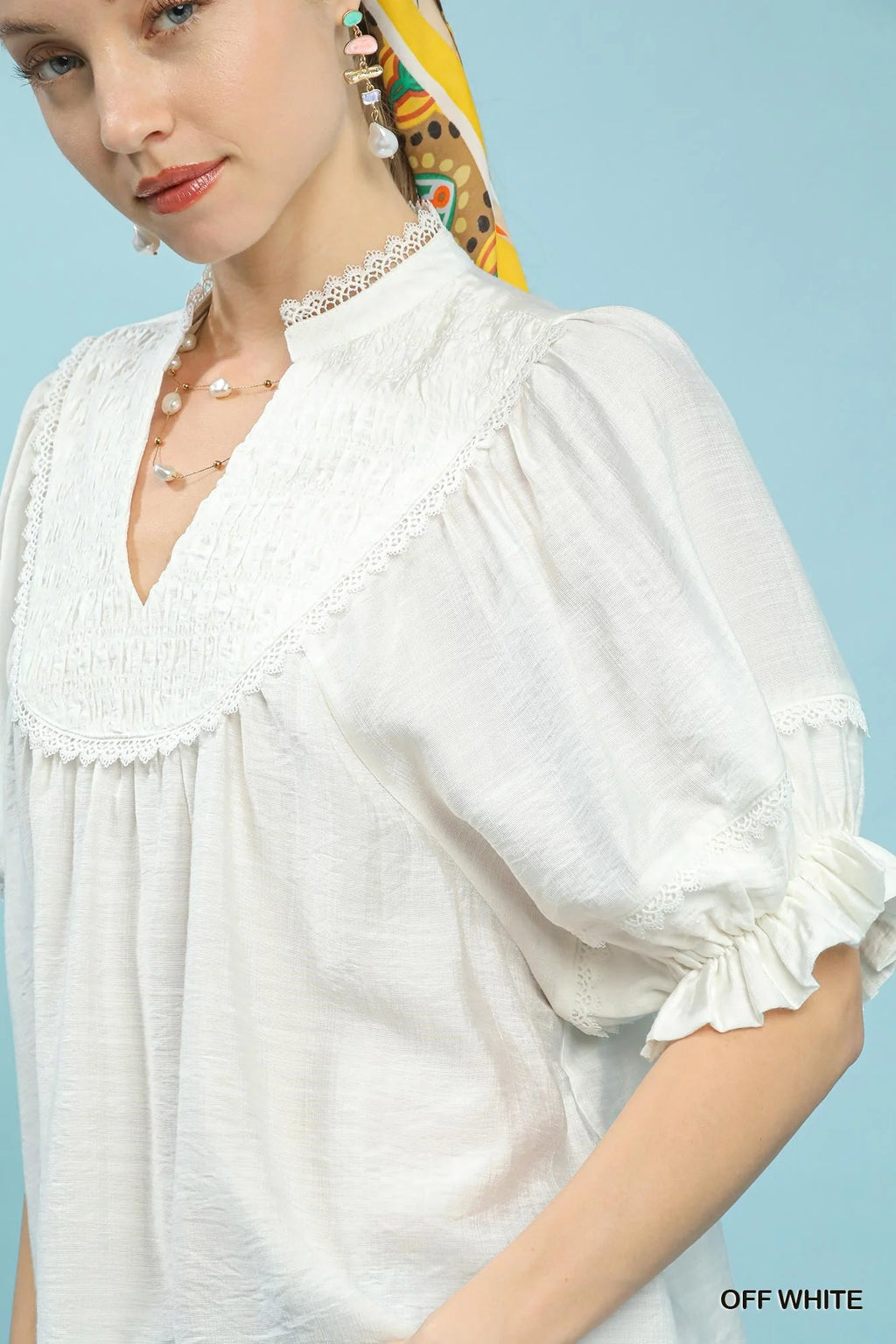 Off White Smocked Yoke Blouse with Ruffle Sleeves by Umgee